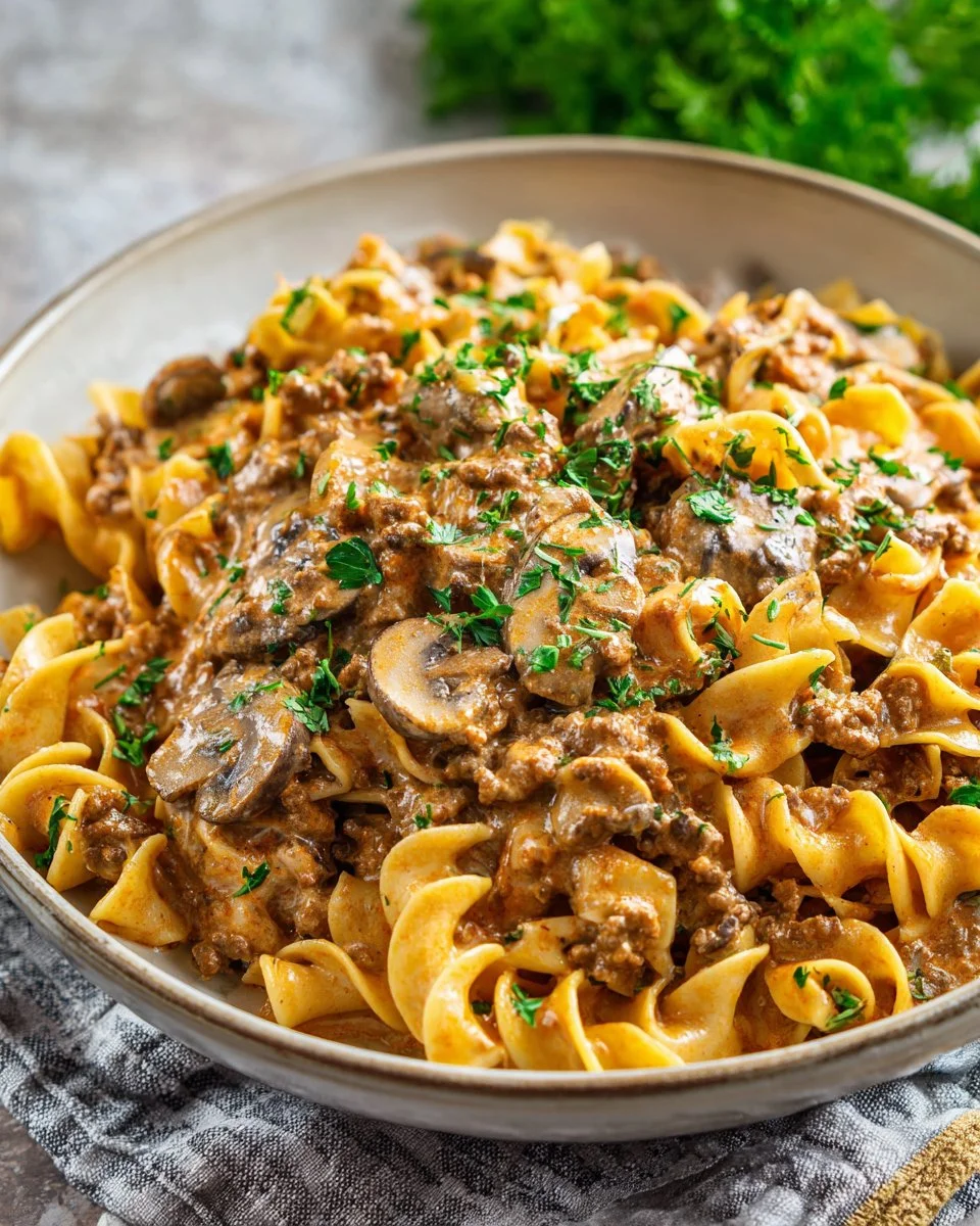 30-Minute Ground Beef Stroganoff served with noodles and garnished with parsley
