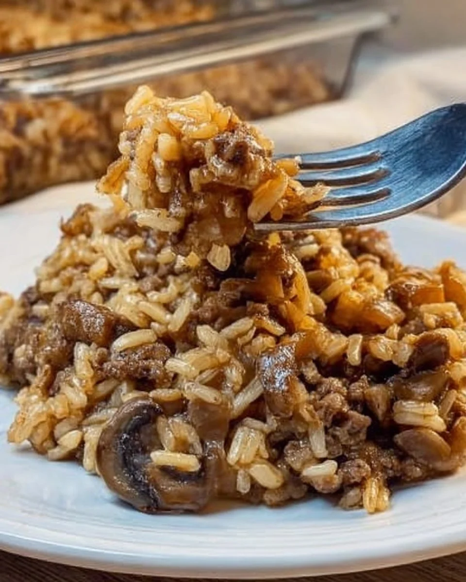 Delicious French Onion Casserole with ground beef and rice, topped with melted cheese