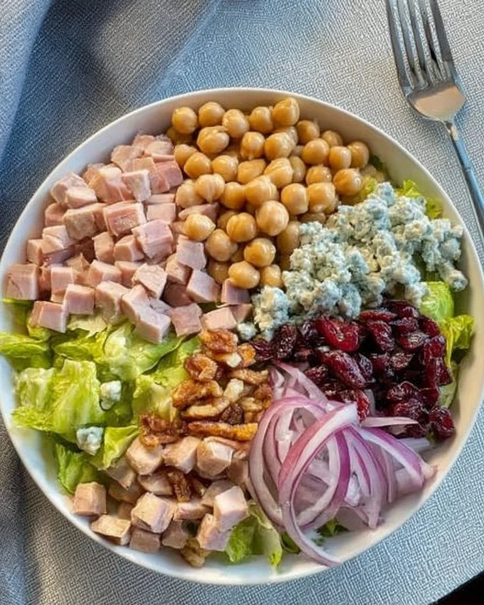 Delicious Turkey and Cranberry Salad in a bowl with fresh greens