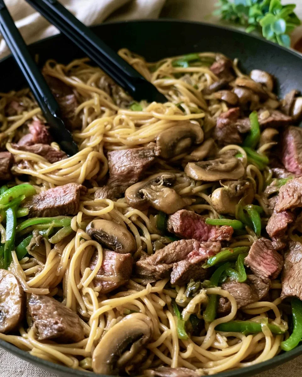 Delicious cheesesteak pasta served with peppers and onions