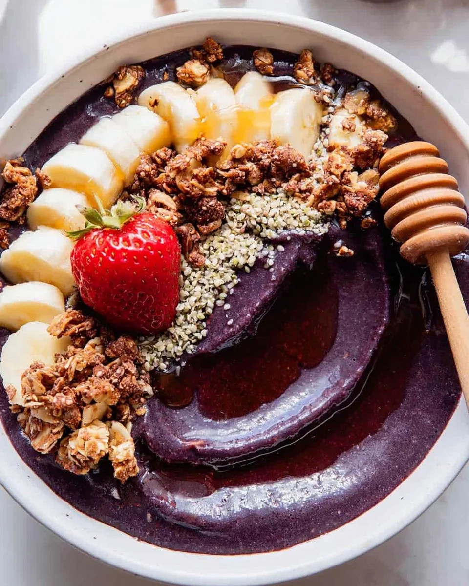 High-protein acai bowl topped with fruits, nuts, and seeds for a nutritious meal