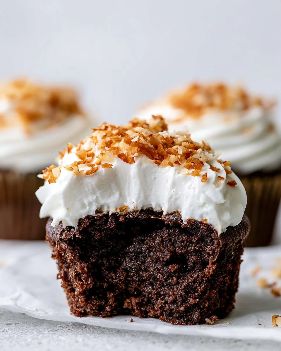 Delicious Chocolate Coconut Cupcakes with frosting and coconut flakes on top