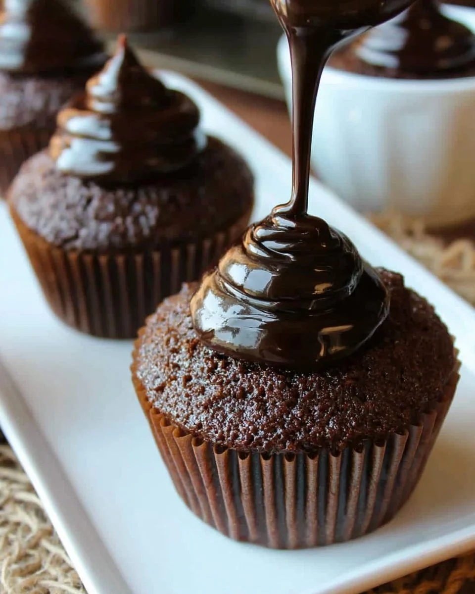 Delicious Chocolate Deception Cupcakes decorated with rich chocolate frosting