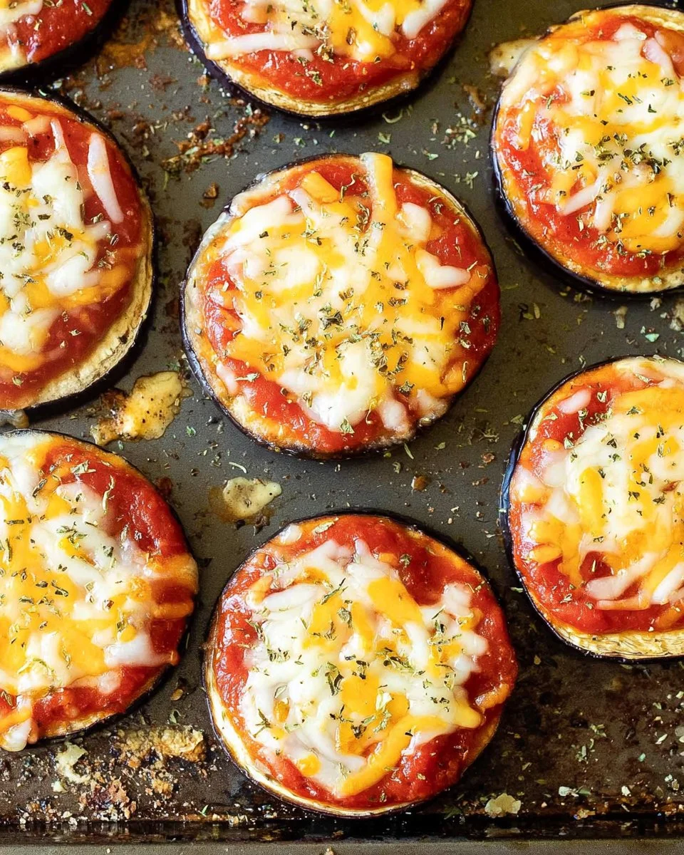 One Pan Eggplant Pizza topped with fresh vegetables and melted cheese