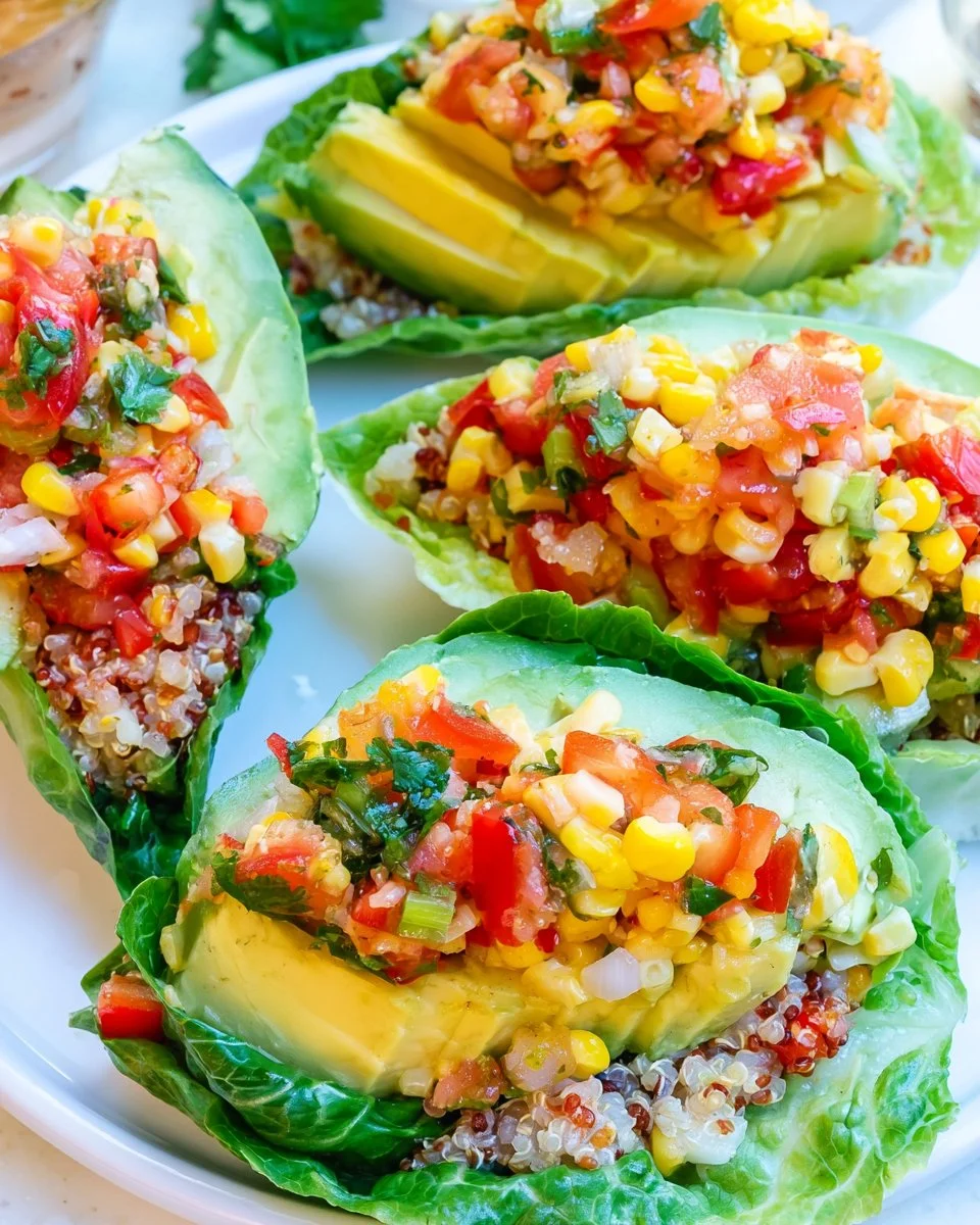 Quinoa Salsa Lettuce Boats filled with colorful veggies and quinoa.